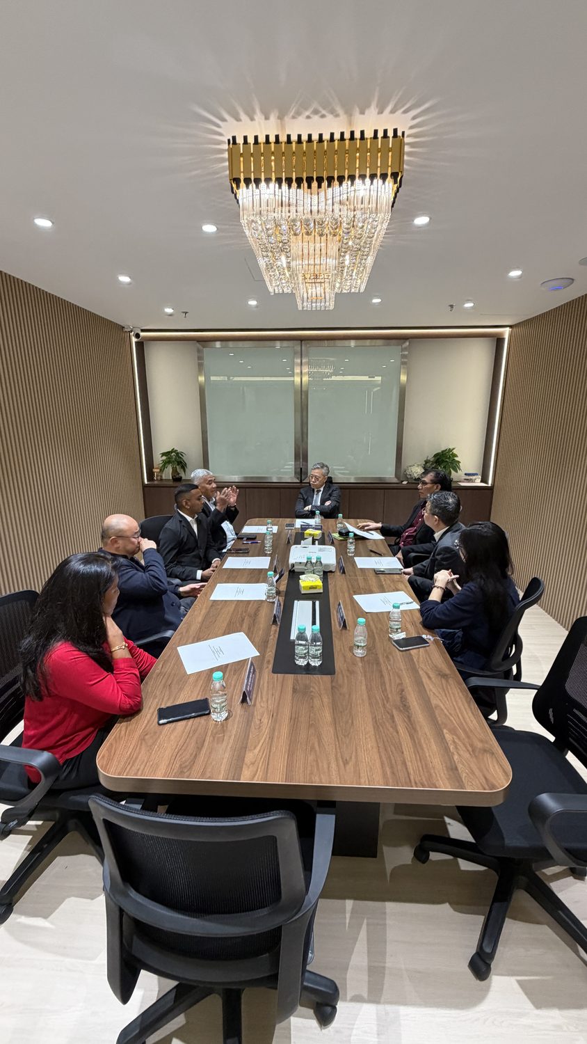 The Erican and MAE delegations in discussion around the boardroom table at Erican Group HQ